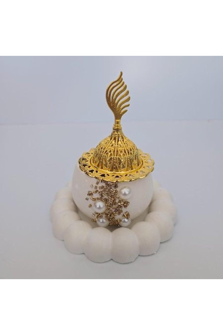 White incense burner with brown and white beads
