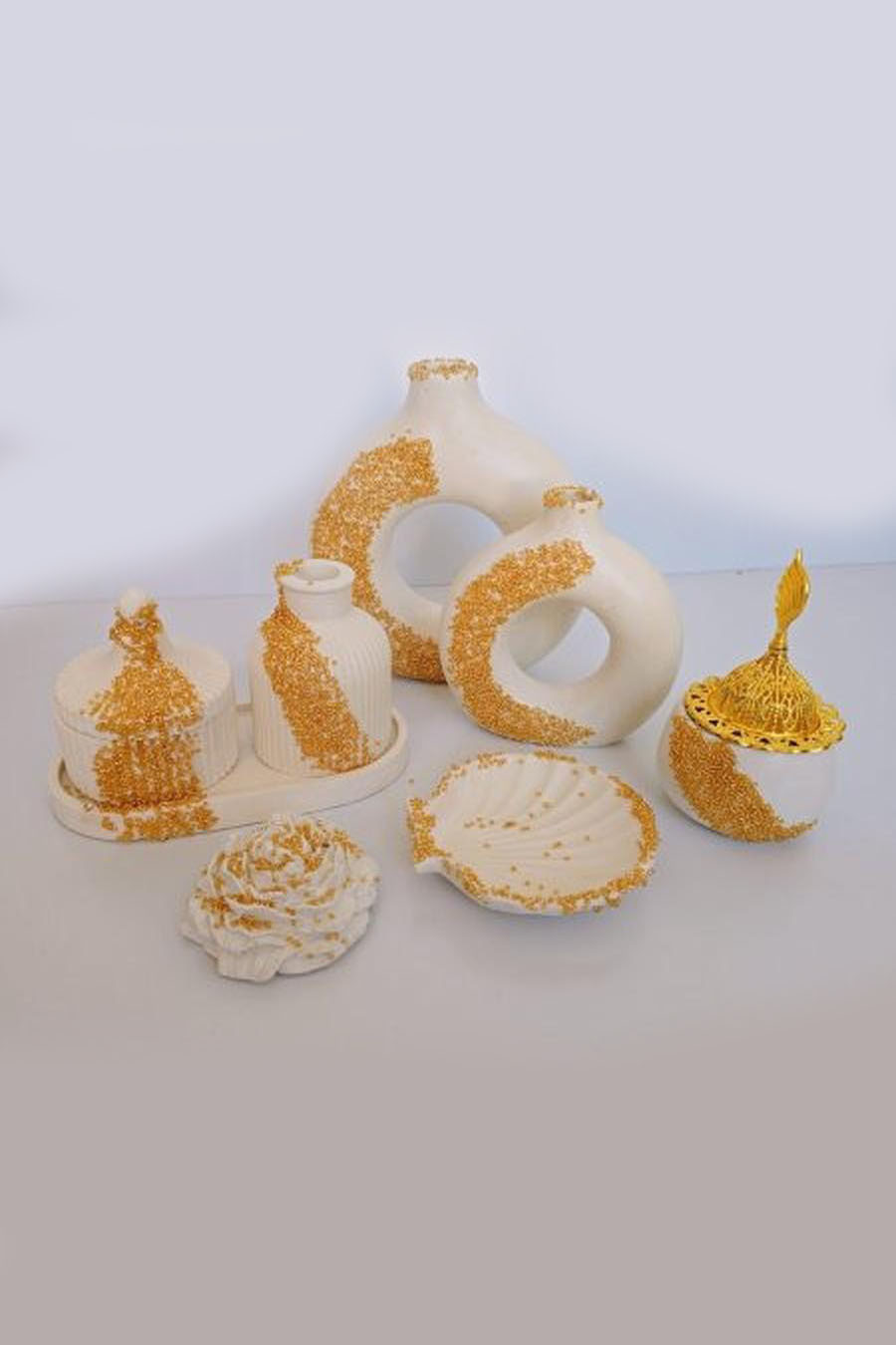 White with gold studs